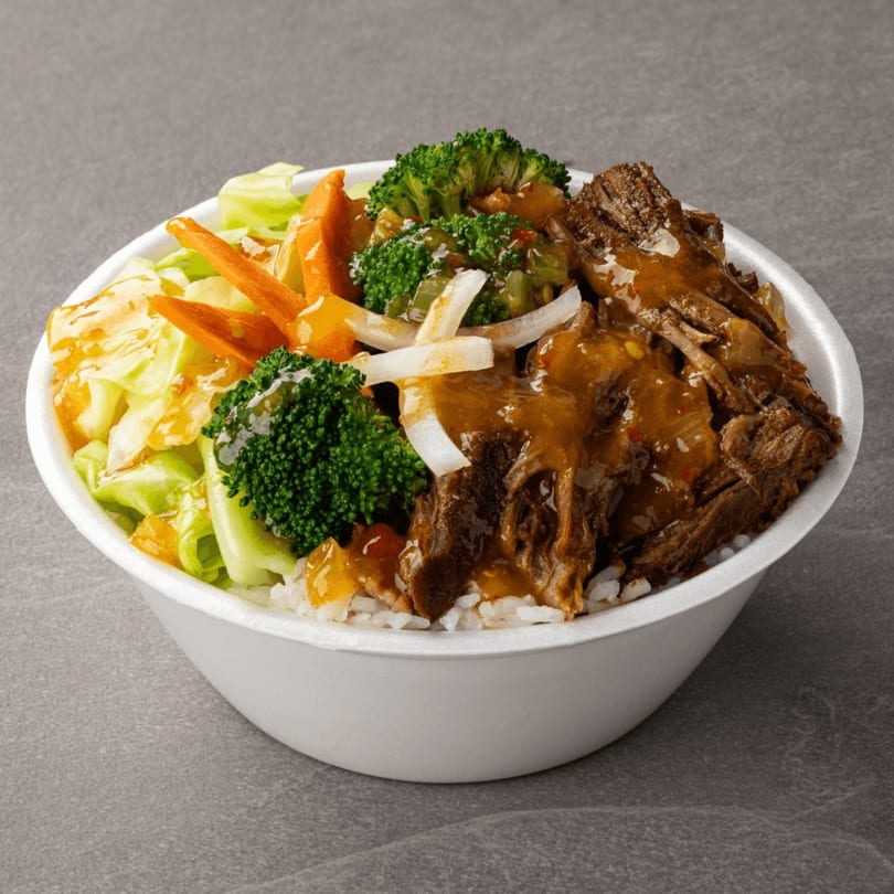 B & C Teriyaki bowl with beef, broccoli, cabbage, carrots, onions, and sauce over rice.